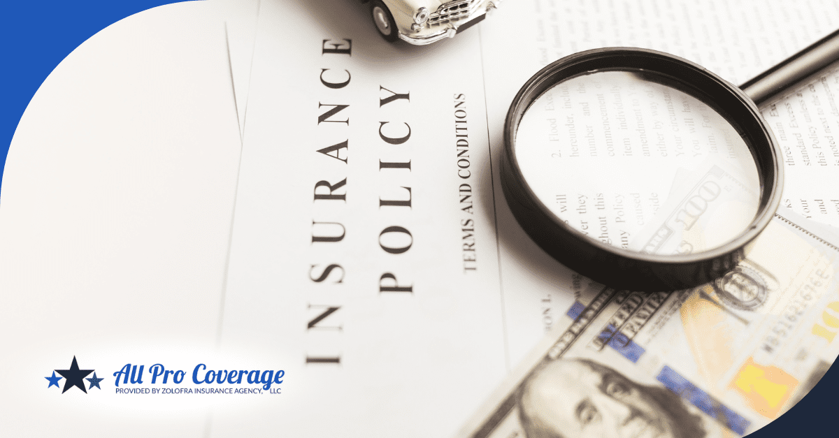 Insurance policy document with a magnifying glass, money, and a toy car placed on top.