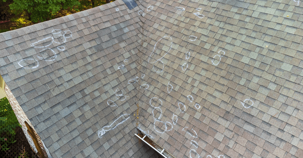Close-up of a roof showing chalk markings for inspection.