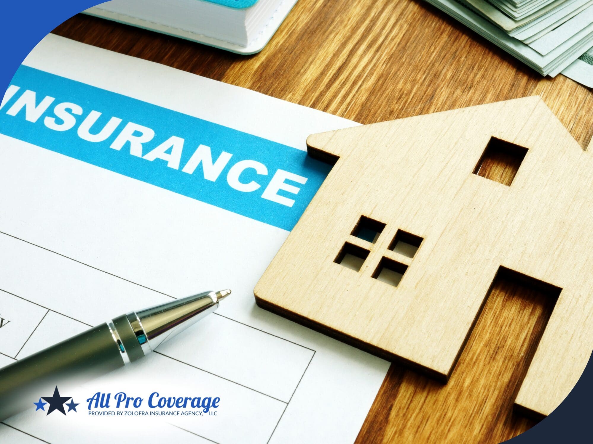 Insurance document with a wooden house model and pen.