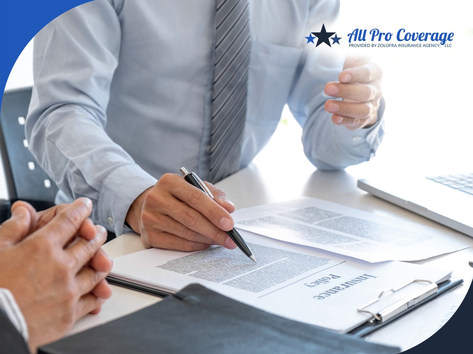 Insurance agent discussing policy details with a client.